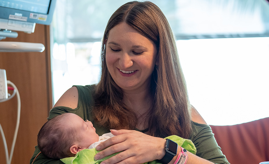 Heather, holding baby