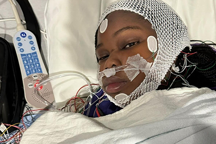 Michaelah being monitored with electrode cap in the pediatric Epilepsy Monitoring Unit.