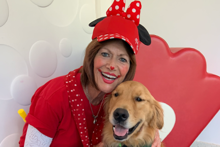 Lotsy Dotsy hugging Freedom pet therapy dog