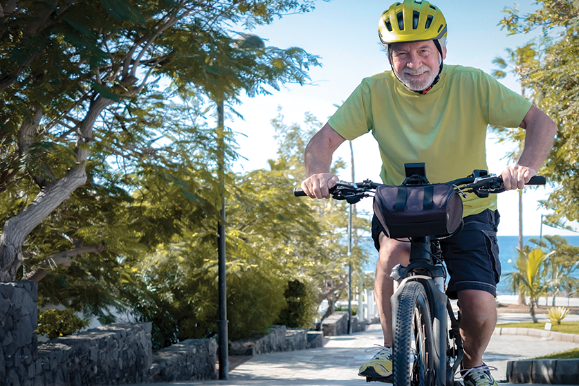 senior man riding electric bike