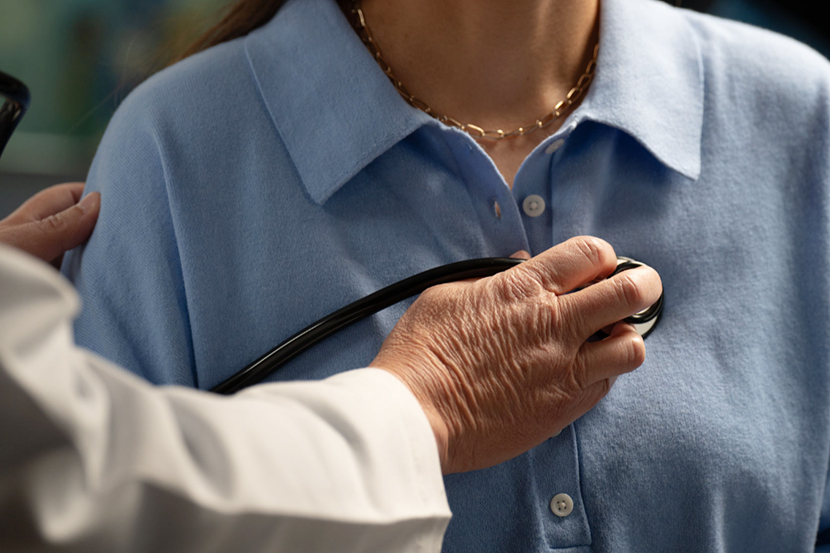 Doctor examining the patient by using stethoscope on a patient
