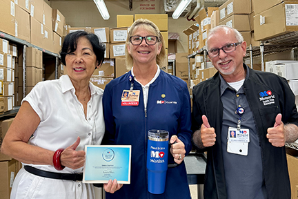 Debora Sherman, Volunteer Spotlight Award recipient, with Supply Chain staff