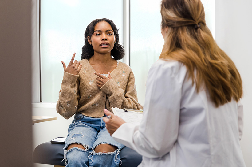 teenage female talking to provider