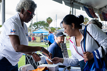 OCAT Hollywood attendee at community organization table