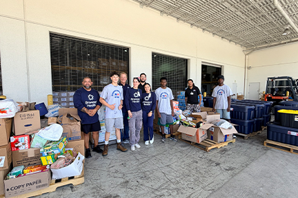Employees from Memorial and Broward Health preparing relief supplies at loading dock