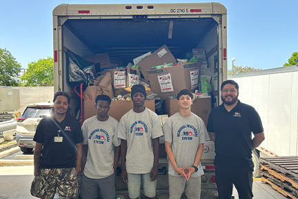 Memorial and Broward Health employees with loaded truck