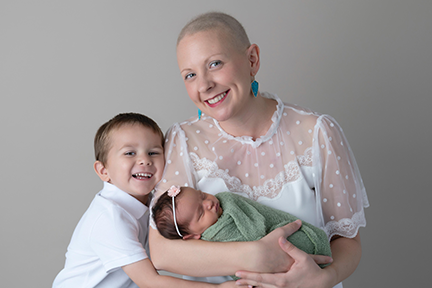 Christina with her son and newborn daughter